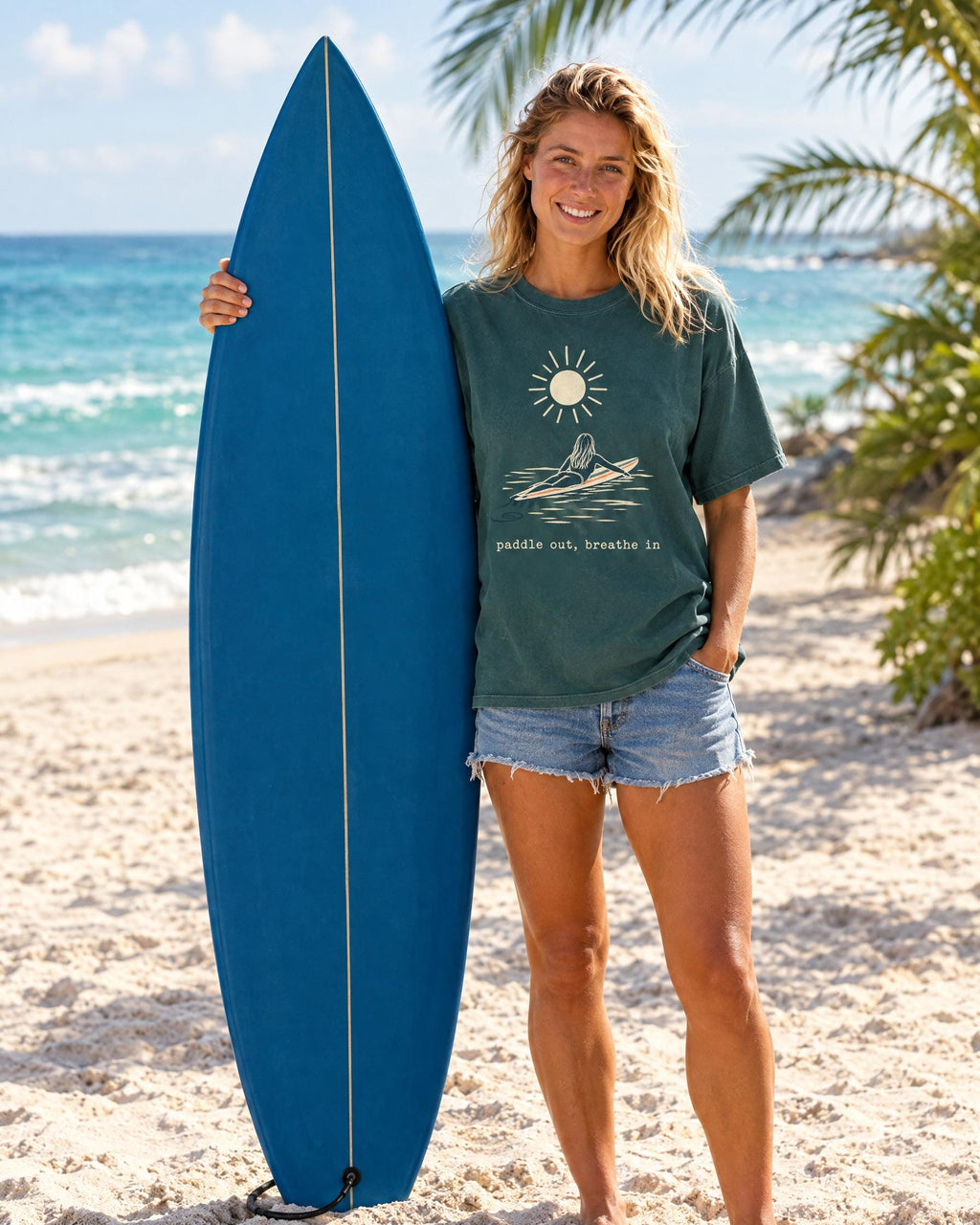 Paddle Out Breathe In tee worn at the beach