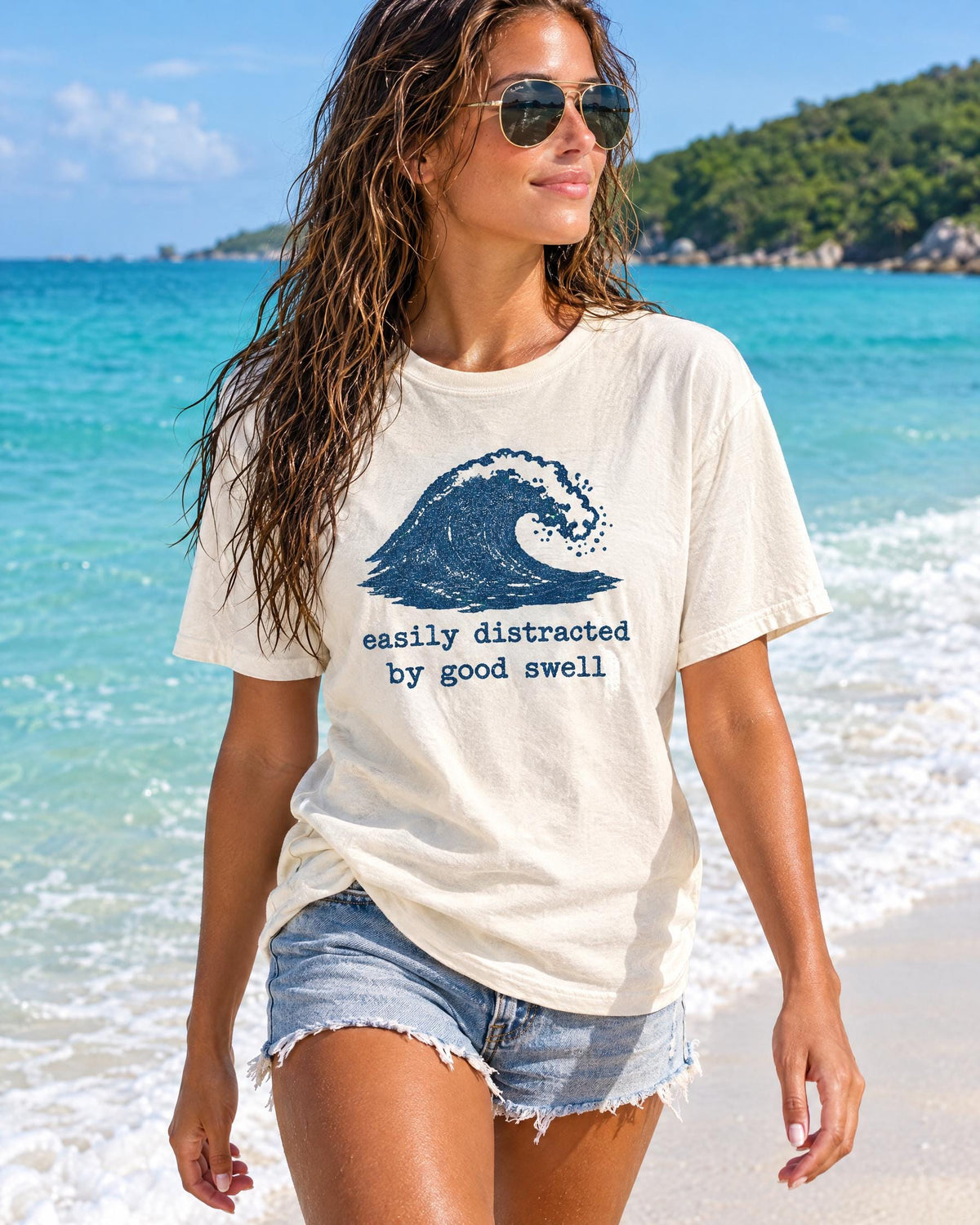 Easily Distracted By Good Swell tee worn at the beach