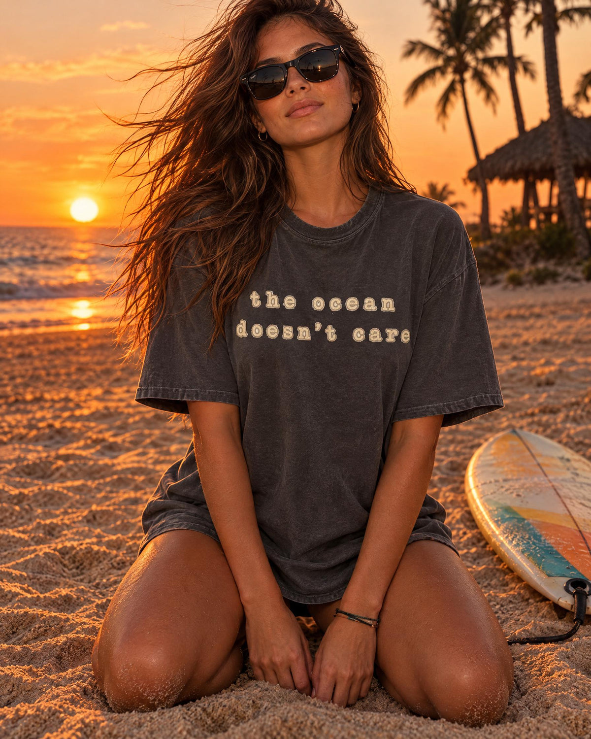The Ocean Doesn't Care tee worn at the beach
